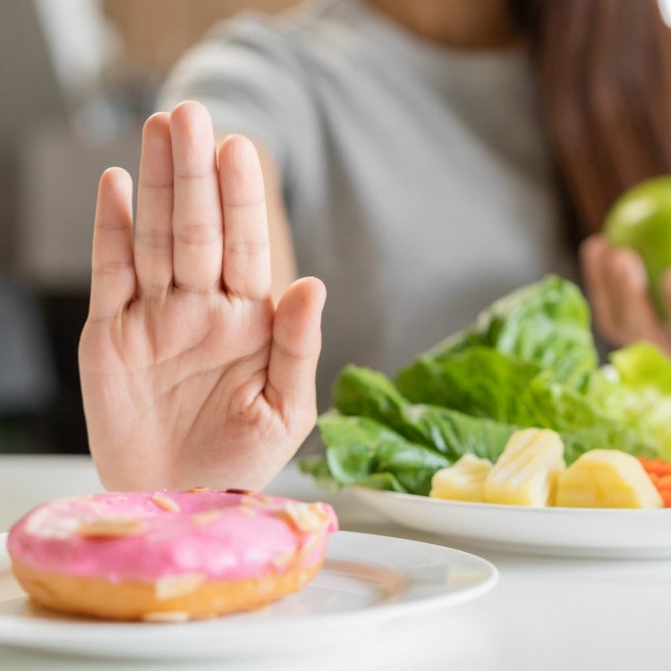 hand refusing a donut