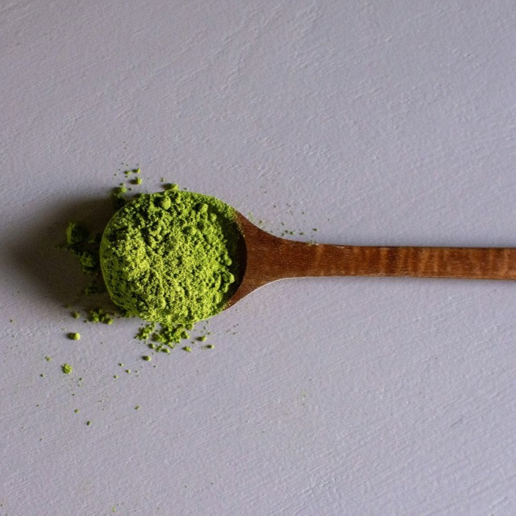 green powder on spoon