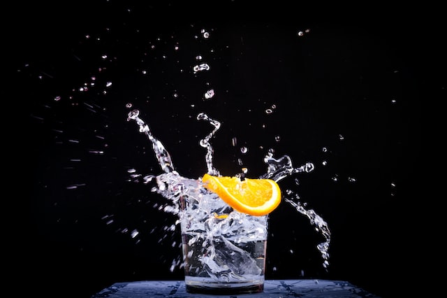 Glass of water with orange