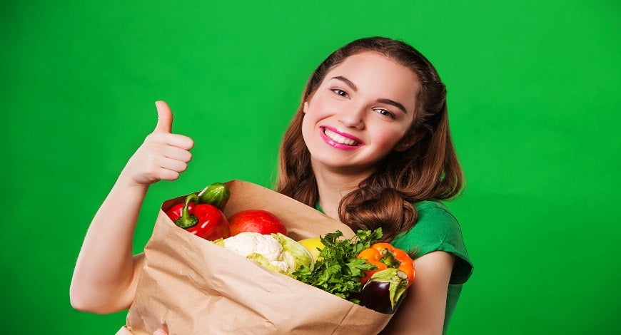 woman with bag of vegetables