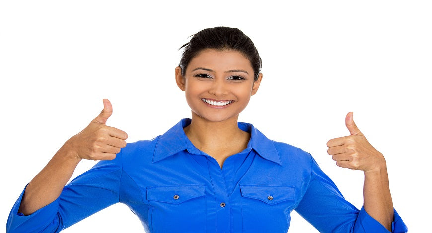 woman in blue shirt doing thumbs up
