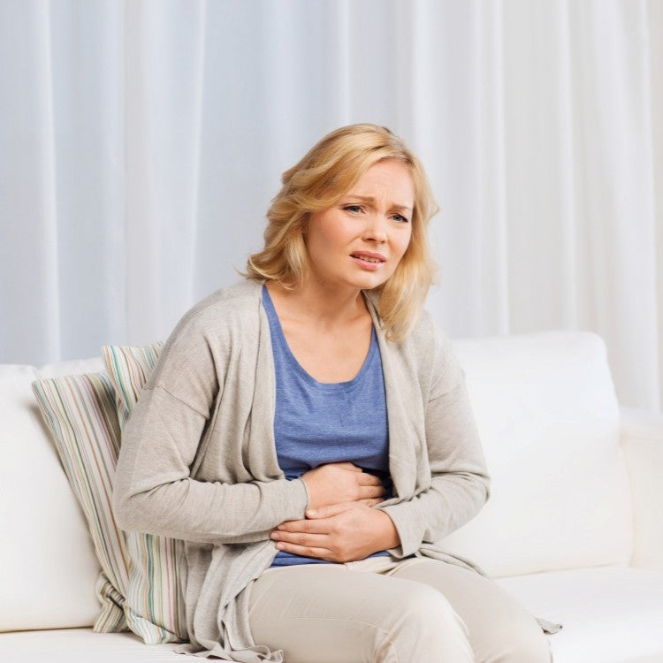 woman holding stomach