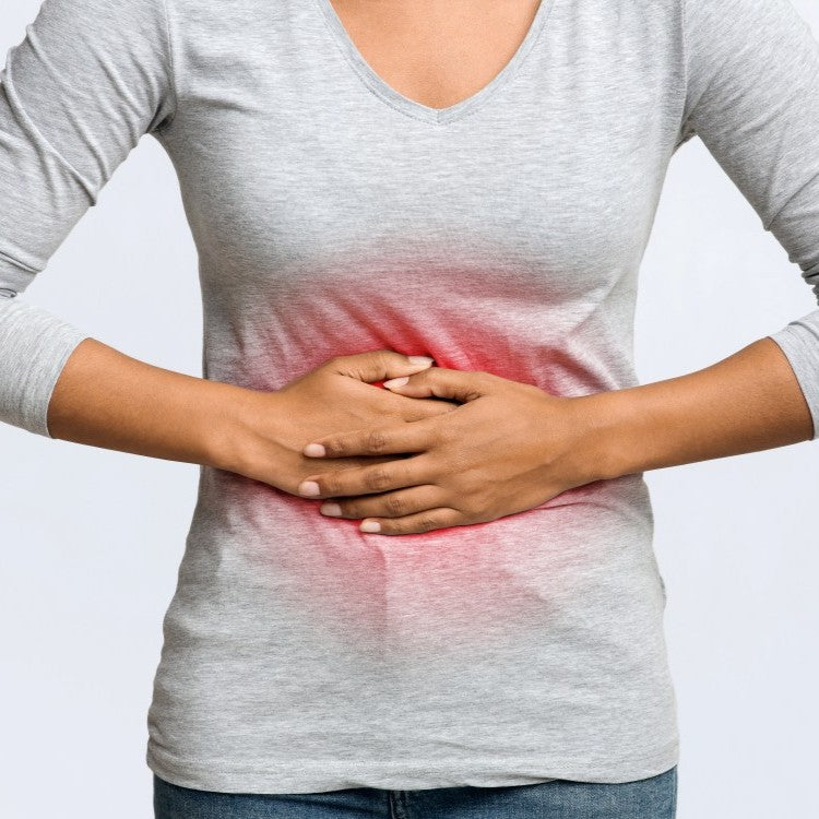 woman holding stomach