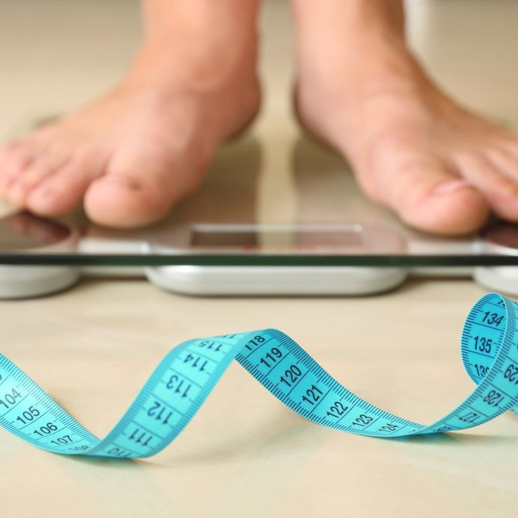 pair of feet on weighing scales