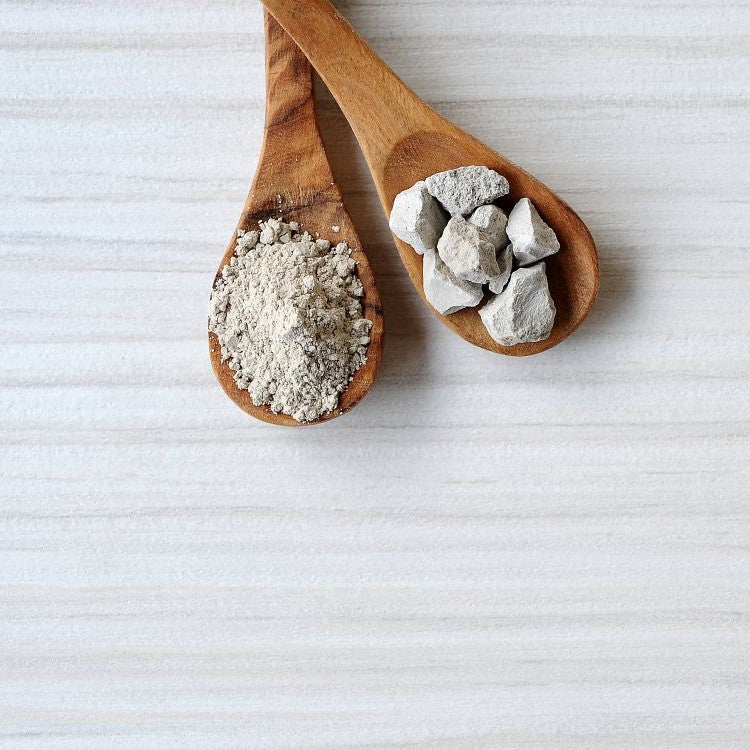 white rocks and powder on spoons