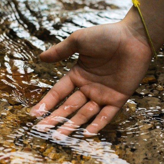 hand in a stream