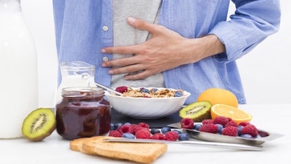 image of person clutching stomach