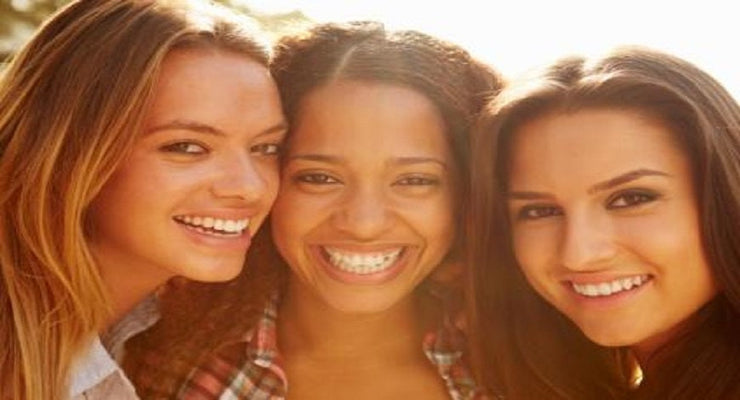 close up faces of three young women