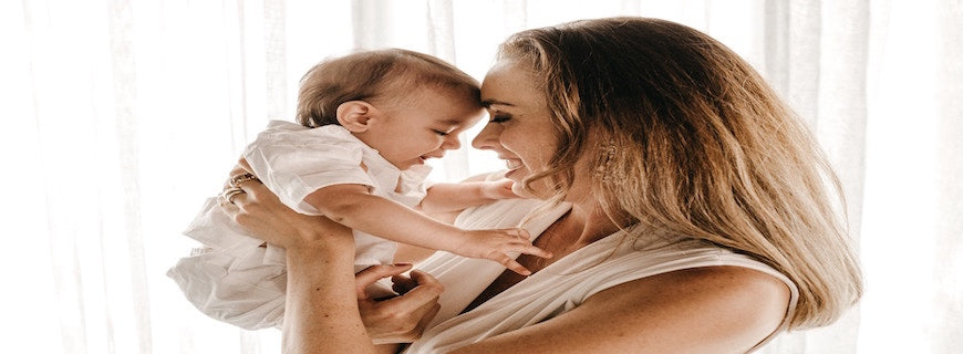 woman holding her baby close