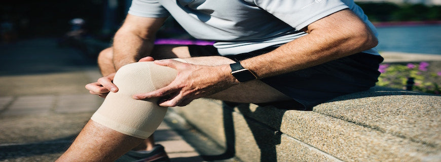 image of man wearing bandage on knee