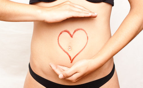 woman with a heart sign on stomach