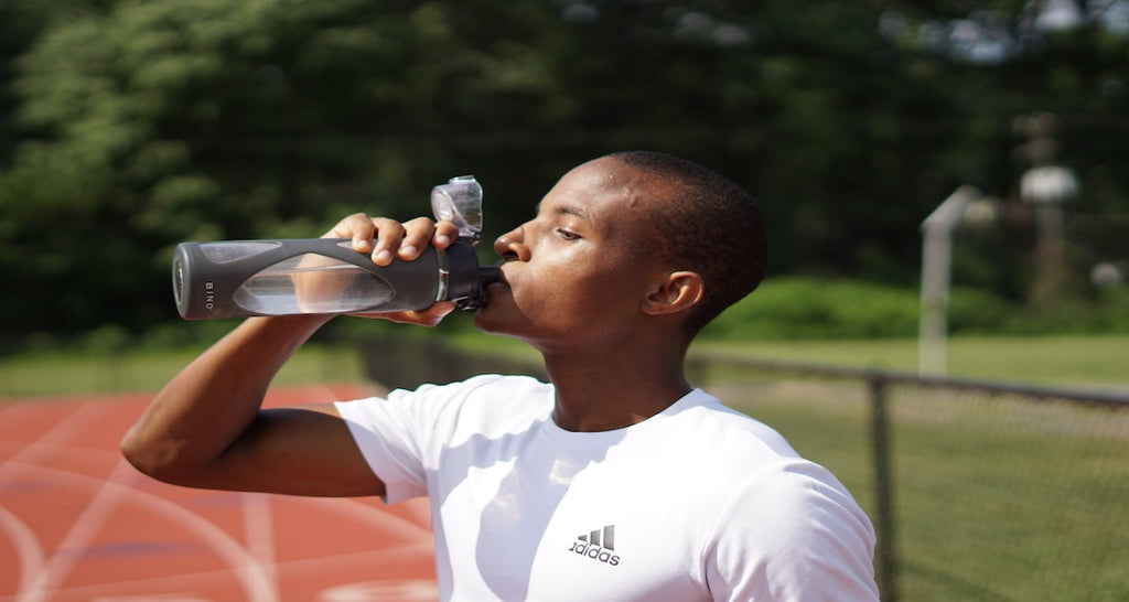 man drink water from a bottle