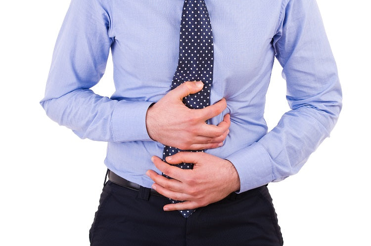 man clutching his stomach