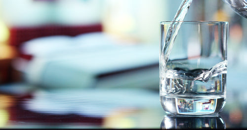 water being poured into a glass