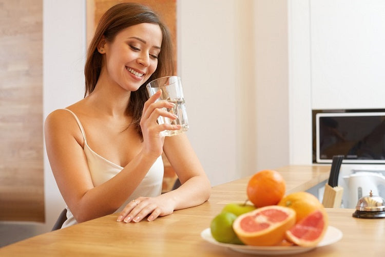 woman drinking glass of water