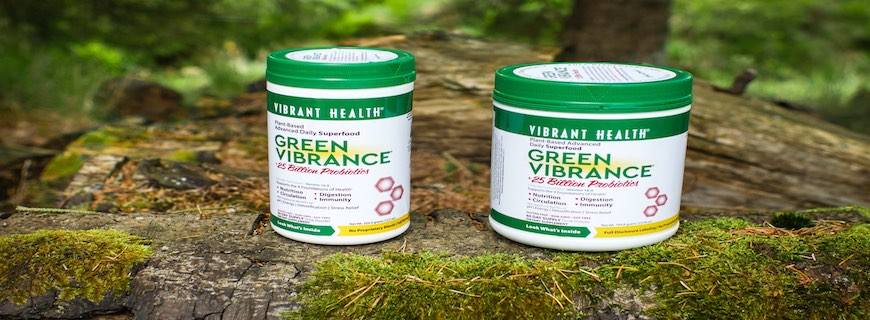 two tubs of Green Vibrance Powder surrounded by nature
