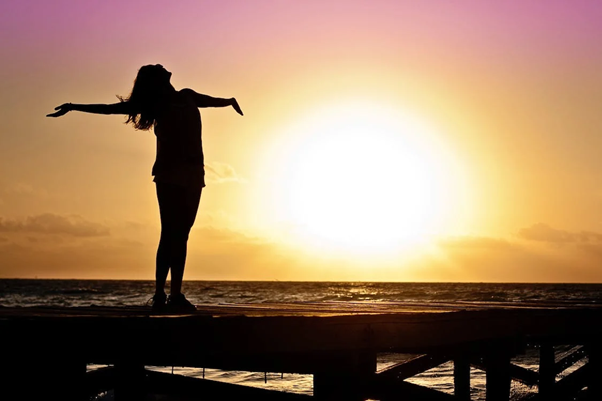 person standing in sunset