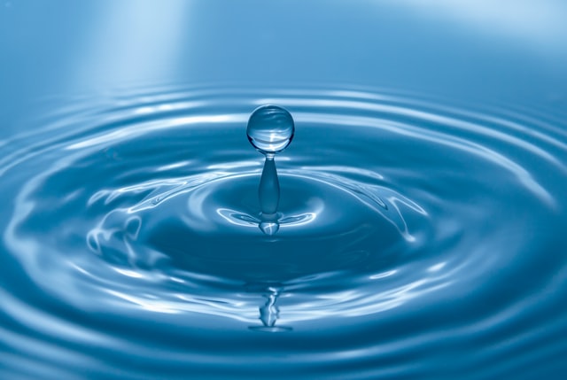 water drop dropping into water