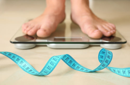 pair of feet on weighing scales