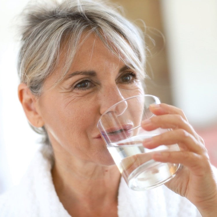 woman drinking glass of water