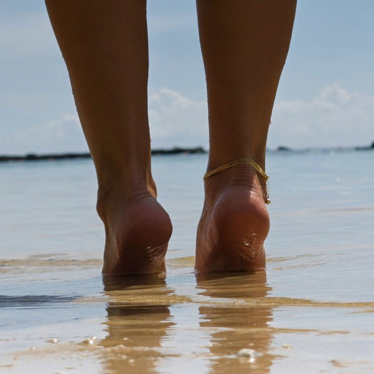 legs paddling on beach