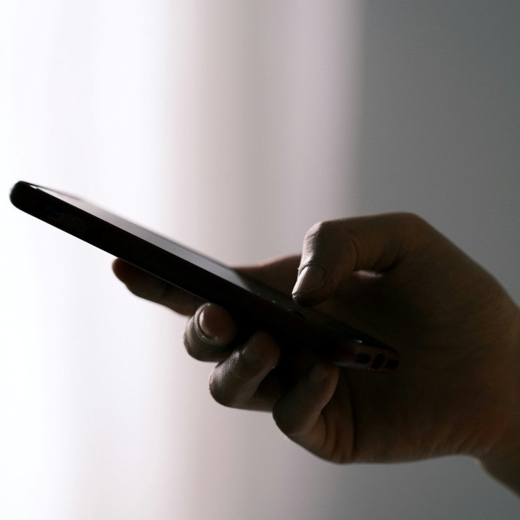 hand with mobile phone