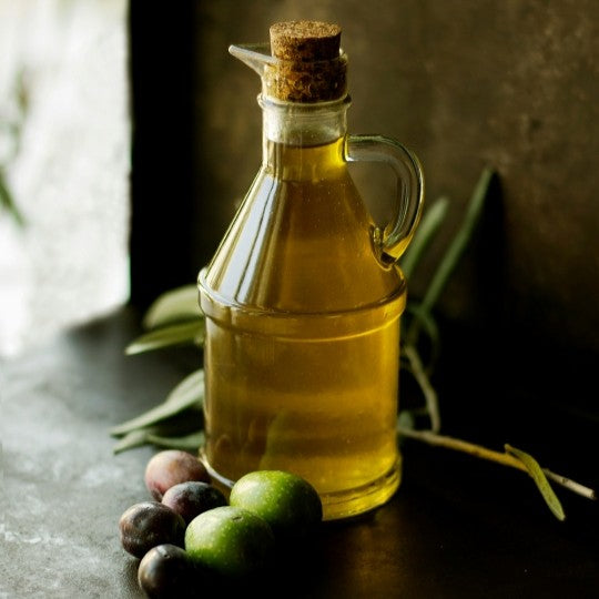 bottle of olive oil and olives