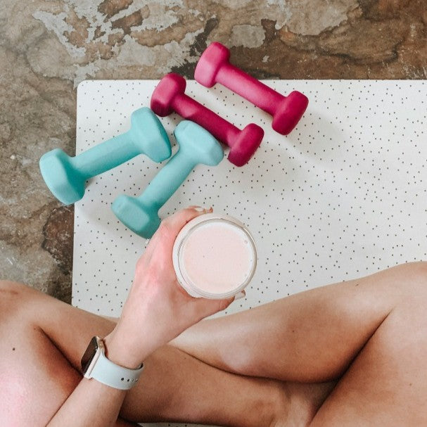 person with shake and weights