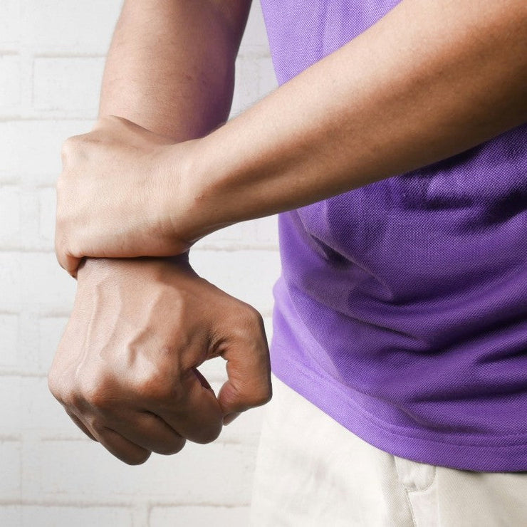 man holding wrist