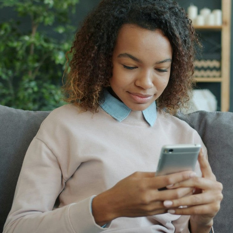 woman looking at phone