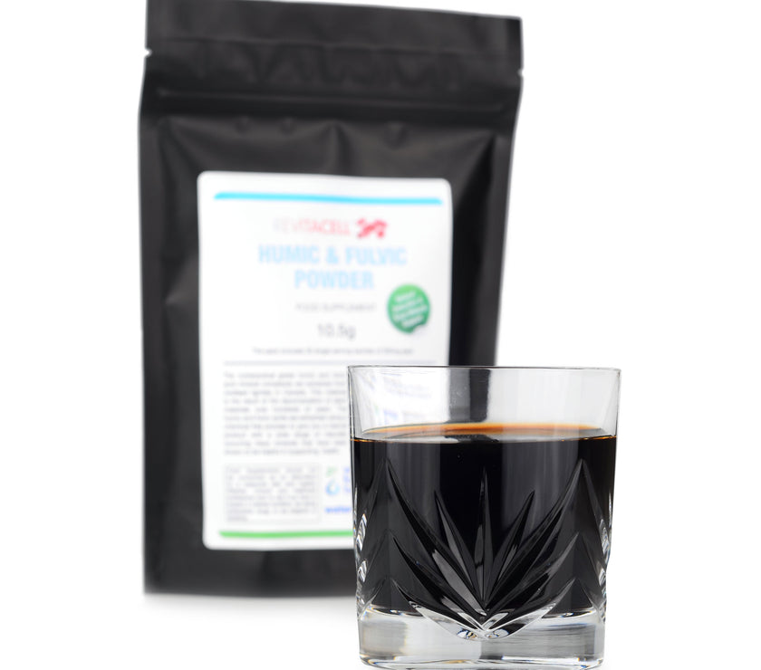 packet of humic and fulvic powder sachets and glass of powder with water