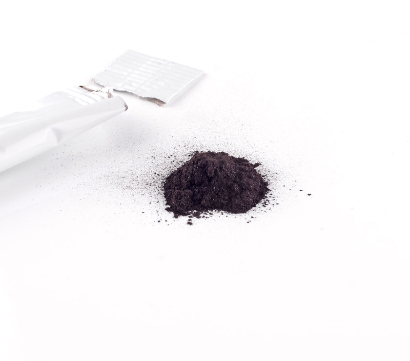 open sachet of humic and fulvic powder and contents